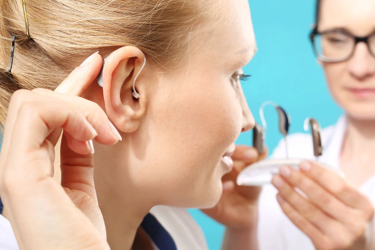 Doctor Offering Hearing Aid To Patient 1200x800 1